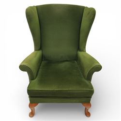 Parker Knoll - pair of 'Penhurst' wingback armchairs upholstered in olive green fabric, on light stained supports 