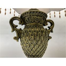Pair bronzed amphora lamps with pineapple decoration, scroll handles and foliate base with scrolled feet together with pair peach ground shades and raised floral pattern H76cm (2)