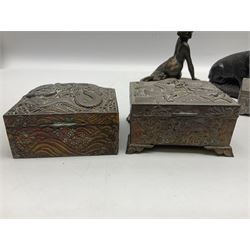 Chinese copper rectangular box decorated in relief with dragon in a rough sea, with a hinged lid, together with a similar example with inlaid wooden detail to the inside, three other metal boxes and two composite figures, one in the form of a pig and the other in form of a woman