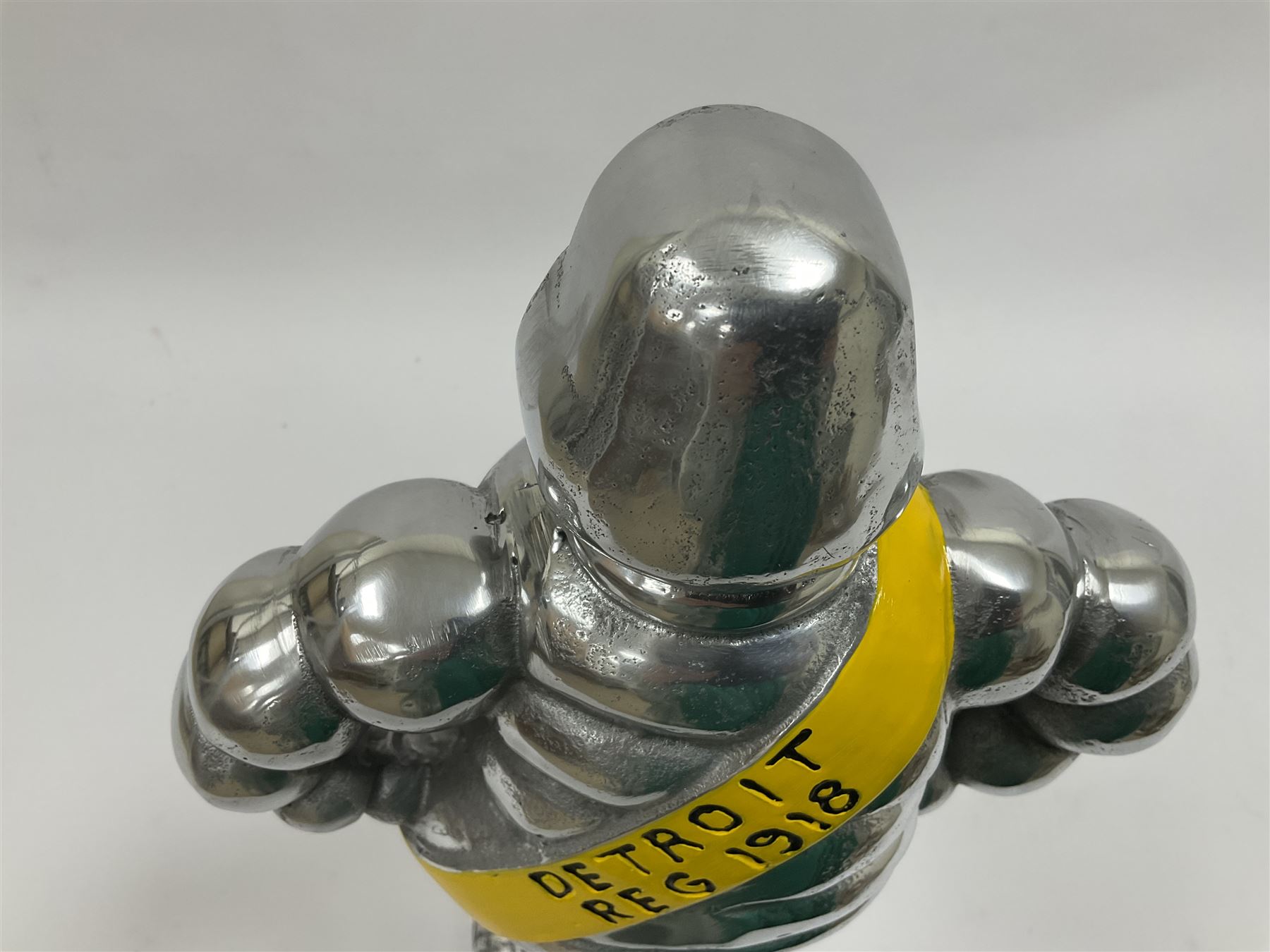 Polished aluminium Michelin man style figure, H38cm.