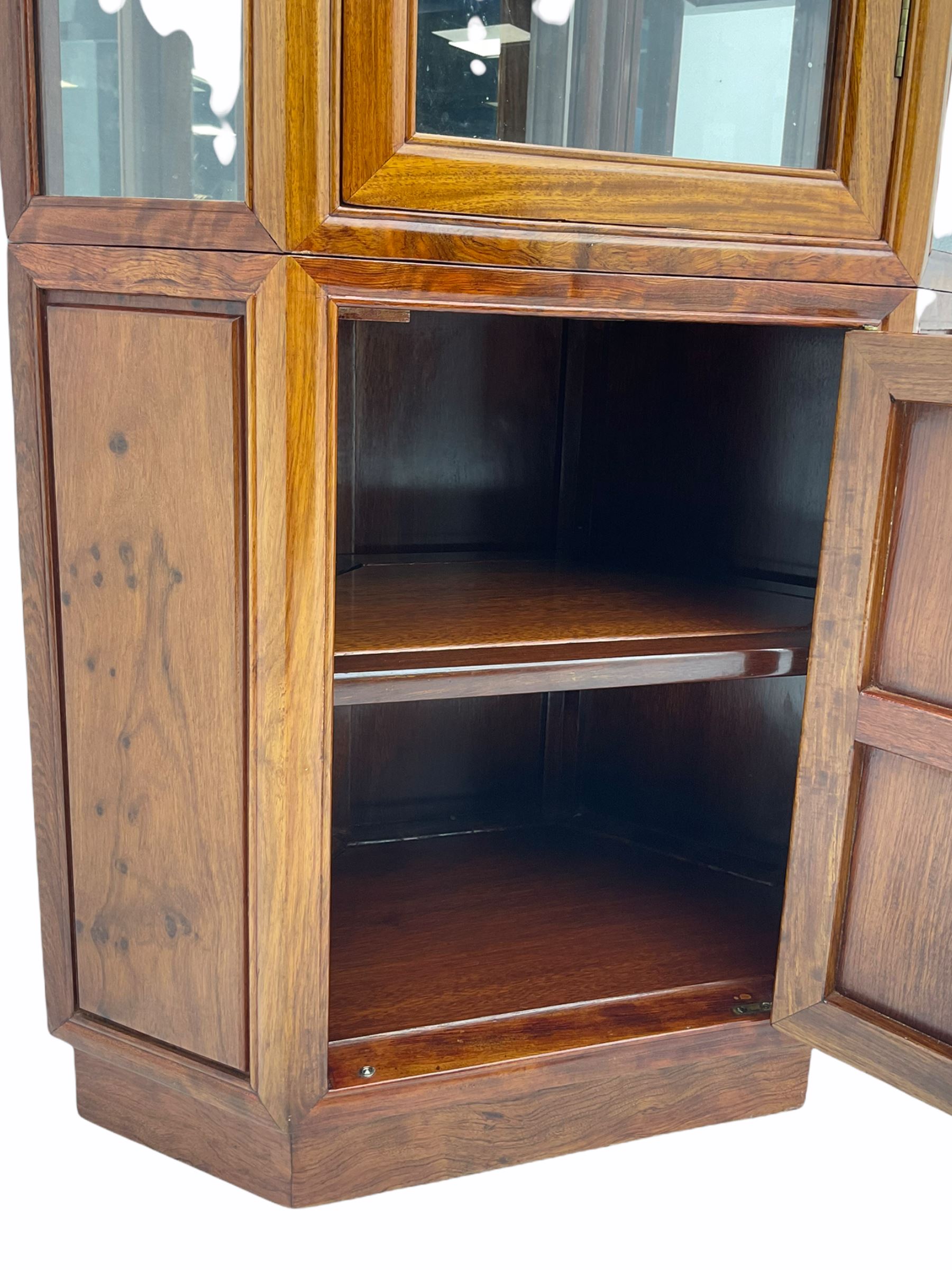 Chinese rosewood corner display cabinet, upper glazed illuminated cabinet above lower cupboard