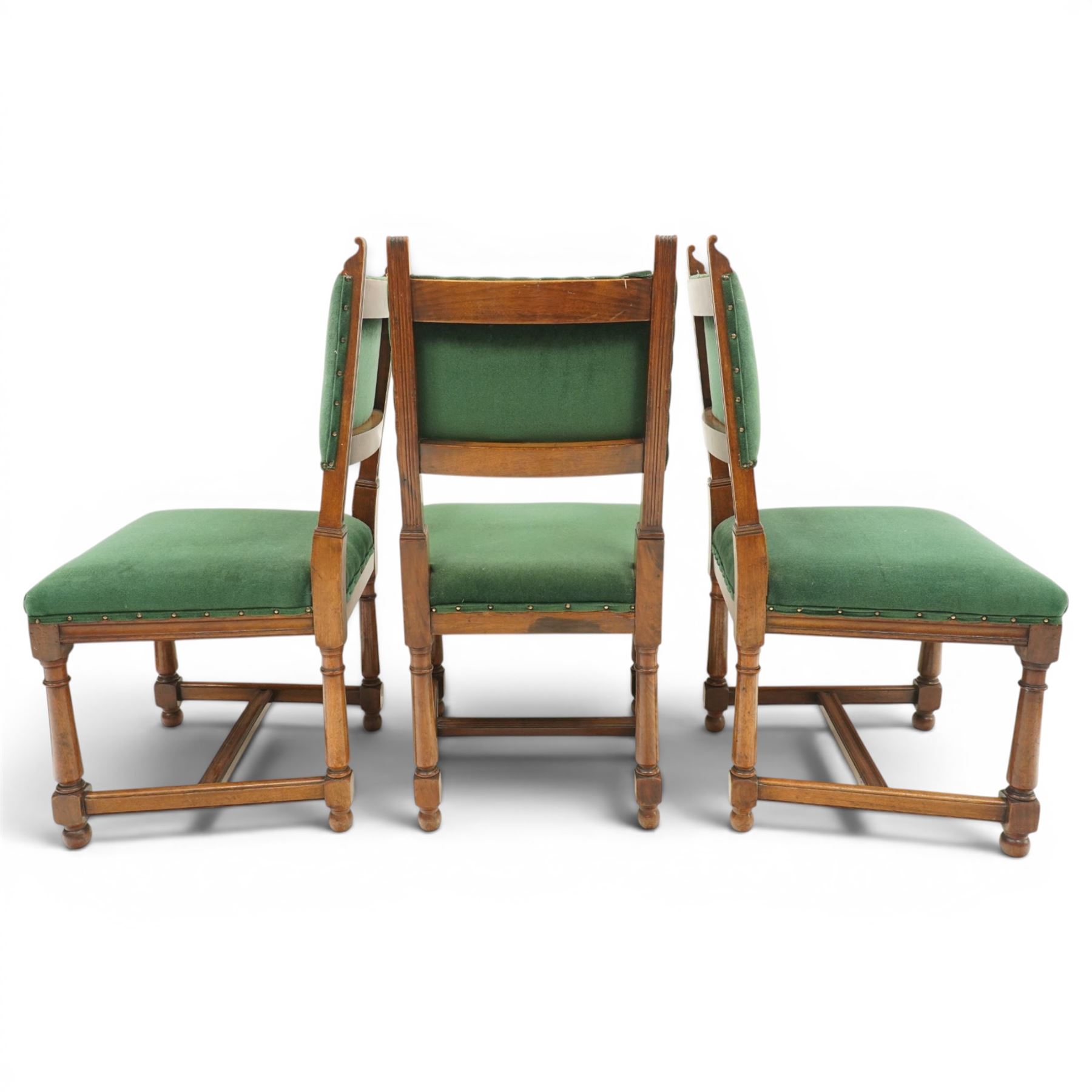 17th century style mahogany set of six dining chairs, with carved scrolled finials, padded green velvet upholstery, block and turned supports united by stretcher  