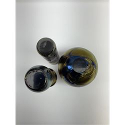 Group of Phoenician Malta art glass vases, all decorated with iridescent amethyst swirl pattern, comprising a spherical example, cylindrical example and baluster shaped example with flared rim, all signed beneath, tallest H20.5cm