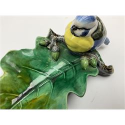 Minton majolica leaf dish, modelled as a Blue Tit perched on a branch with acorns and an oak leaf, date cypher for 1868, impressed marks beneath, L21cm. 