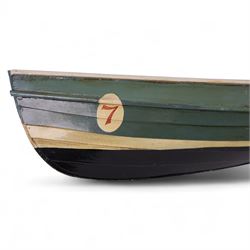 Two wooden fishing coble models, comprising SE31, with rudder, painted in blue, white and red and SSS.33 'Alice', painted in green, black and yellow, largest H16cm, L70cm