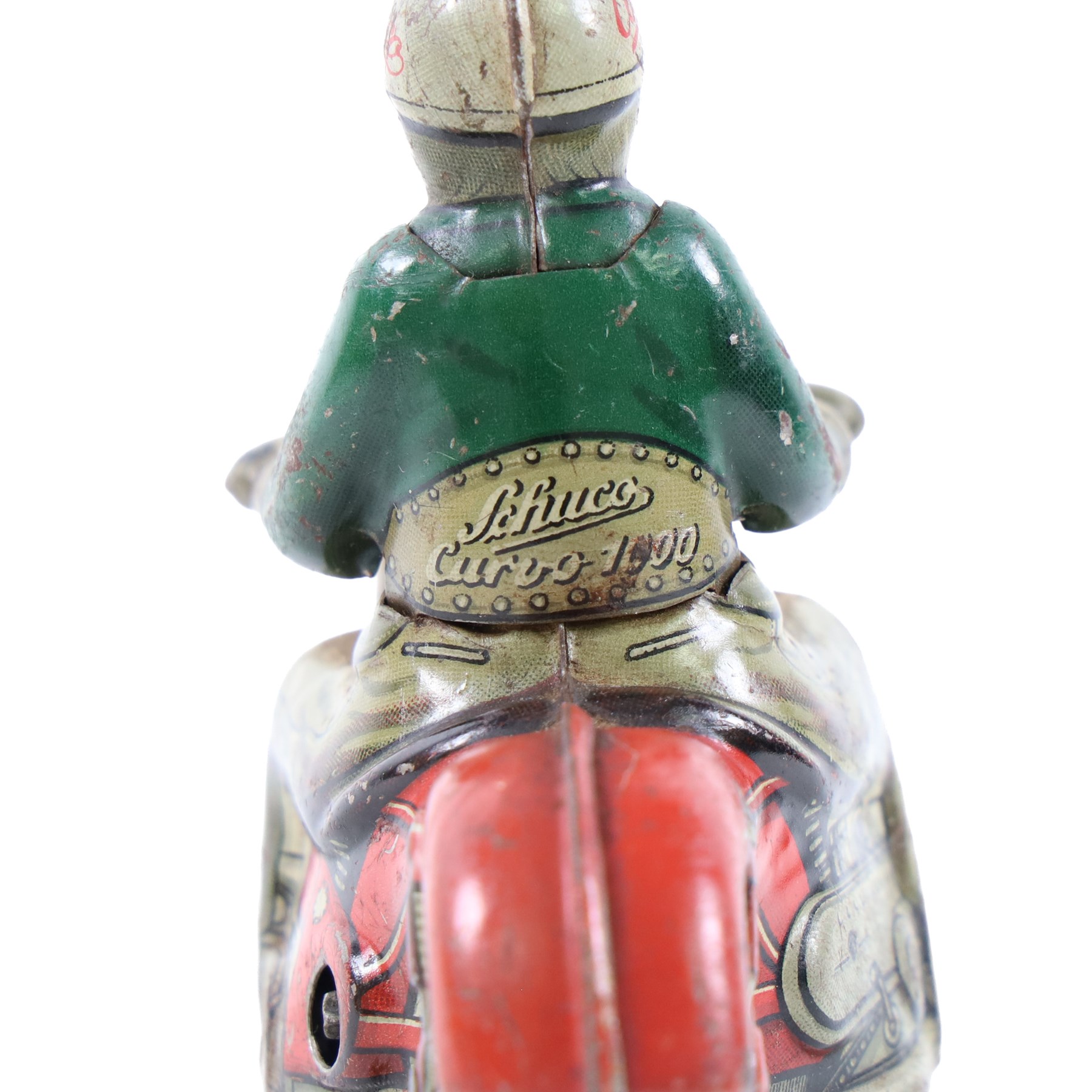 Schuco Curvo 1000 tinplate clockwork motorcycle, in red and cream, with rider in green jacket