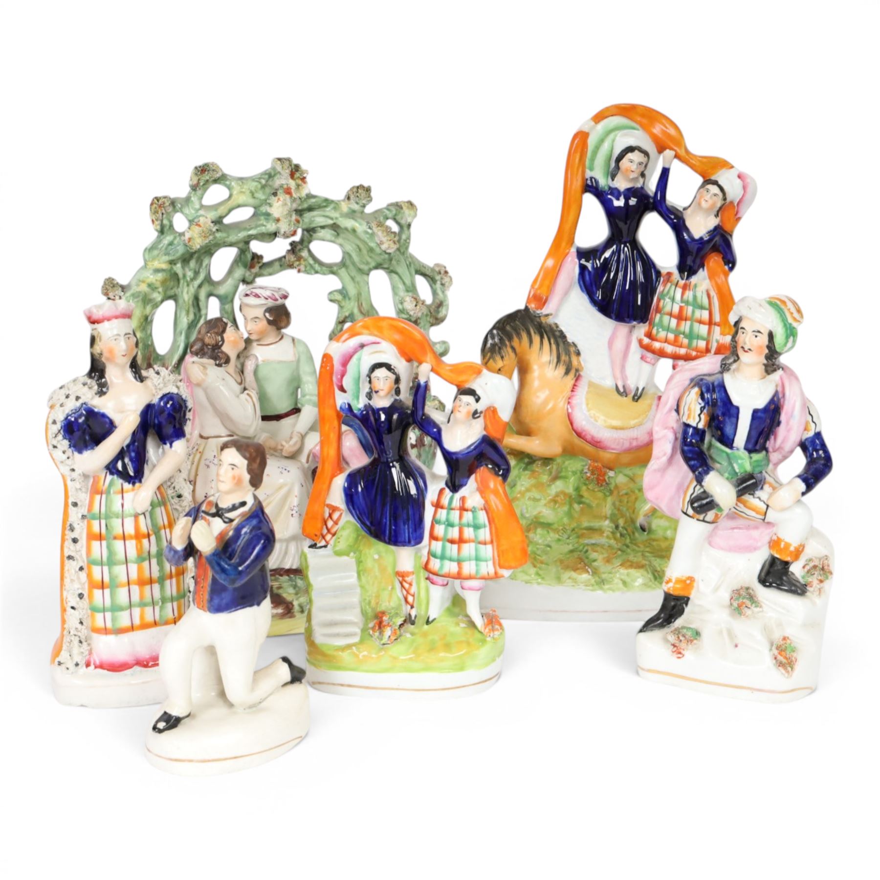 Six 19th century Staffordshire Theatre and Circus figures, comprising 
Mrs Siddons as Lady Macbeth, Conrad from Byron's Poem The Corsair, Madame Vestris as Paul from Paul and Virginia, arbour group by Thomas Parr, possibly depicting Lorenzo and Jessica from Shakespeare's Merchant of Venice, pair of circus trick riders on horseback, and smaller example featuring same pair, tallest example H26.5cm
