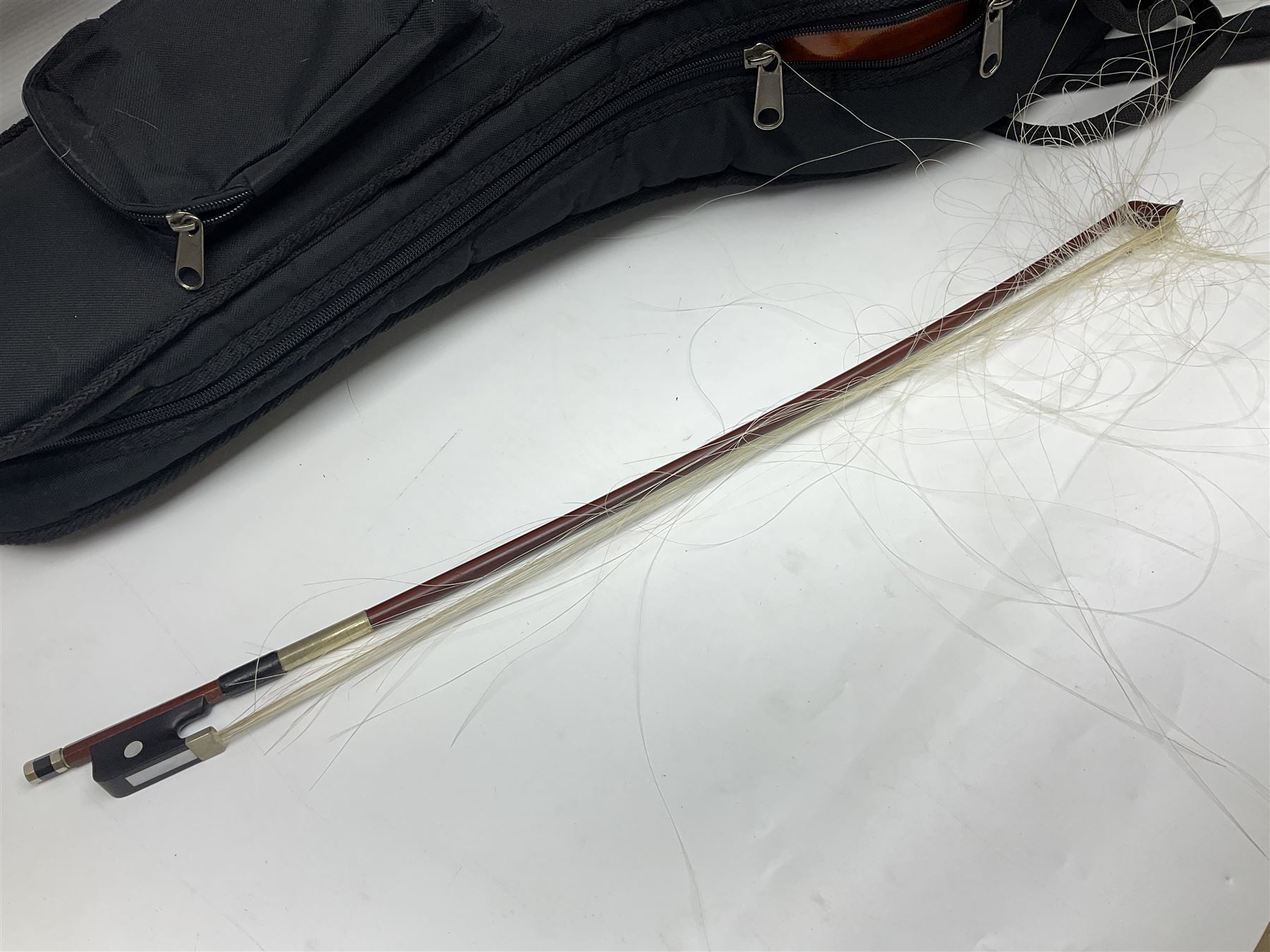 Modern Hungarian half-size cello with 69cm two-piece maple back and ribs and spruce top L114cm overall; and Stentor half size cello bearing label 'The Stentor Student II'; each in soft carrying case (2)