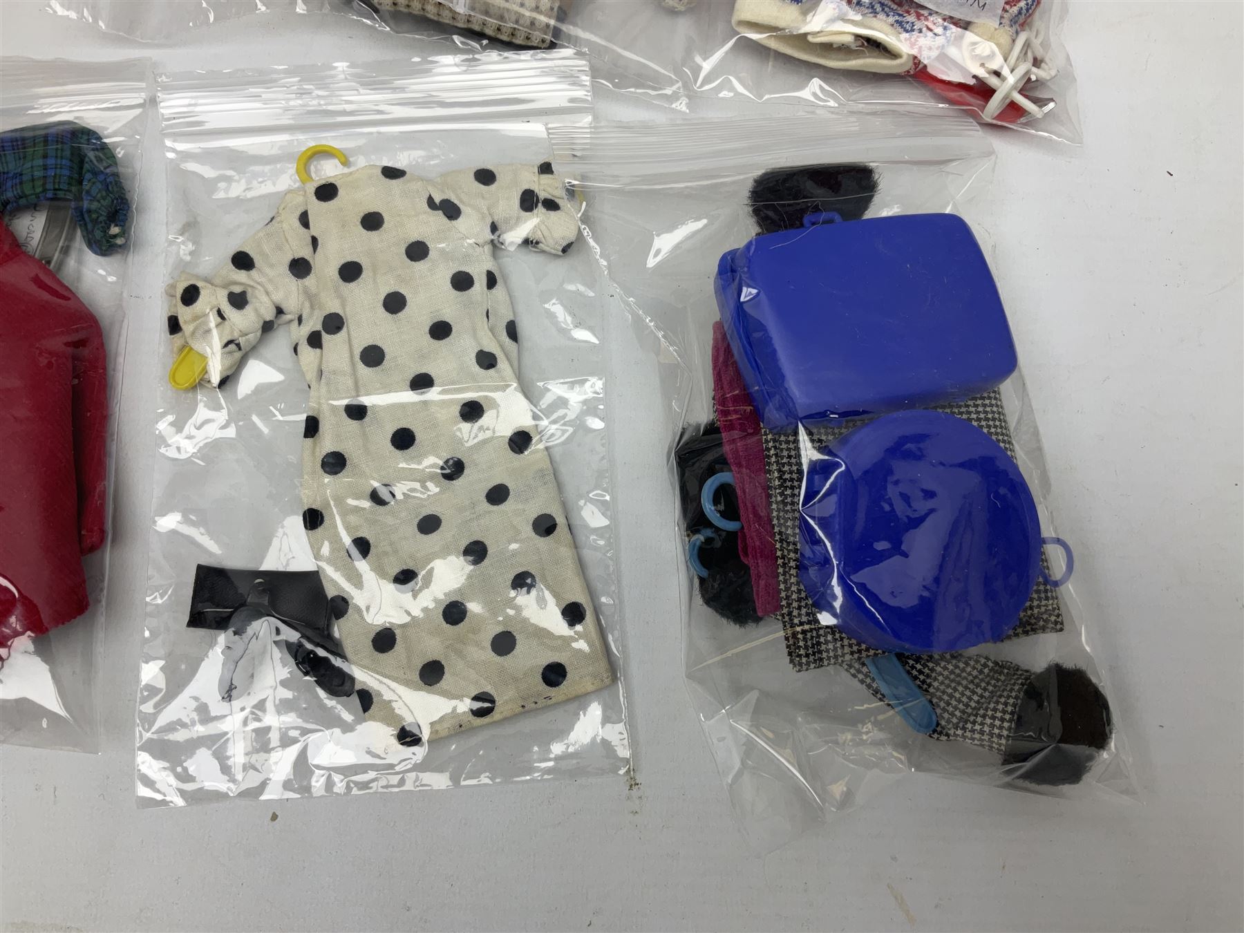 1960s Palitoy Tressy fashion doll, boxed with stand and booklets; four additional Tressy outfits (In The Office, Winter Journey, Winter Sports and Evening Date); two other outfits; and Tressy's Little Sister Toots doll with Style Book and additional outfit