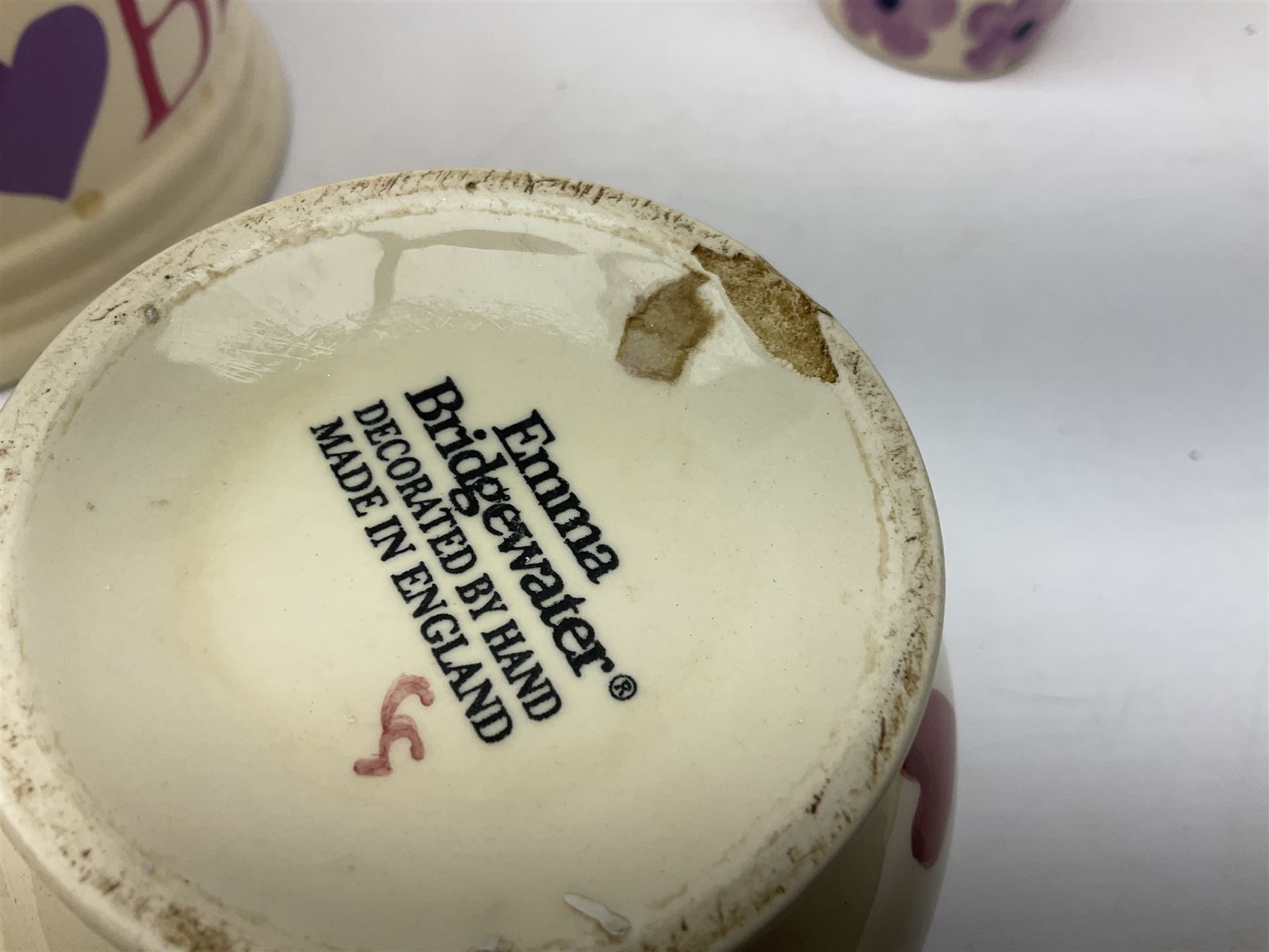 Collection of Emma Bridgewater spongeware ceramics, to include Pink Hearts pattern teapot, milk bottle vase, teacup and saucers, Love & Kisses sugar shaker and large 'I love you more than Marlon Brando' mug, British Birds and Black and White pattern mugs, etc, all with printed marks beneath, tallest H21.5cm