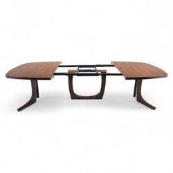 Lynggard Møbler - mid 20th century Danish teak extending dining table, the rounded rectangular veneered top with concealed central leaf, raised on twin sculpted pedestal bases, (Extends to 300cm) combining fine craftsmanship and organic form typical of Scandinavian modern design from the 1960s