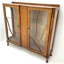 Early 20th century walnut display cabinet, raised back, two glazed single doors revealing fitted interior, cabriole supports 