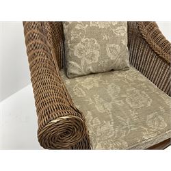 Pair cane armchairs, seat cushions upholstered in a beige floral patterned fabric, carved cabriole supports