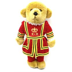 Four Merrythought teddy bears - International Collectors Club limited edition with growler mechanism No.71; plain brown with back-wind musical movement; golden brown dressed as a Beefeater; and earlier light golden coloured (4)