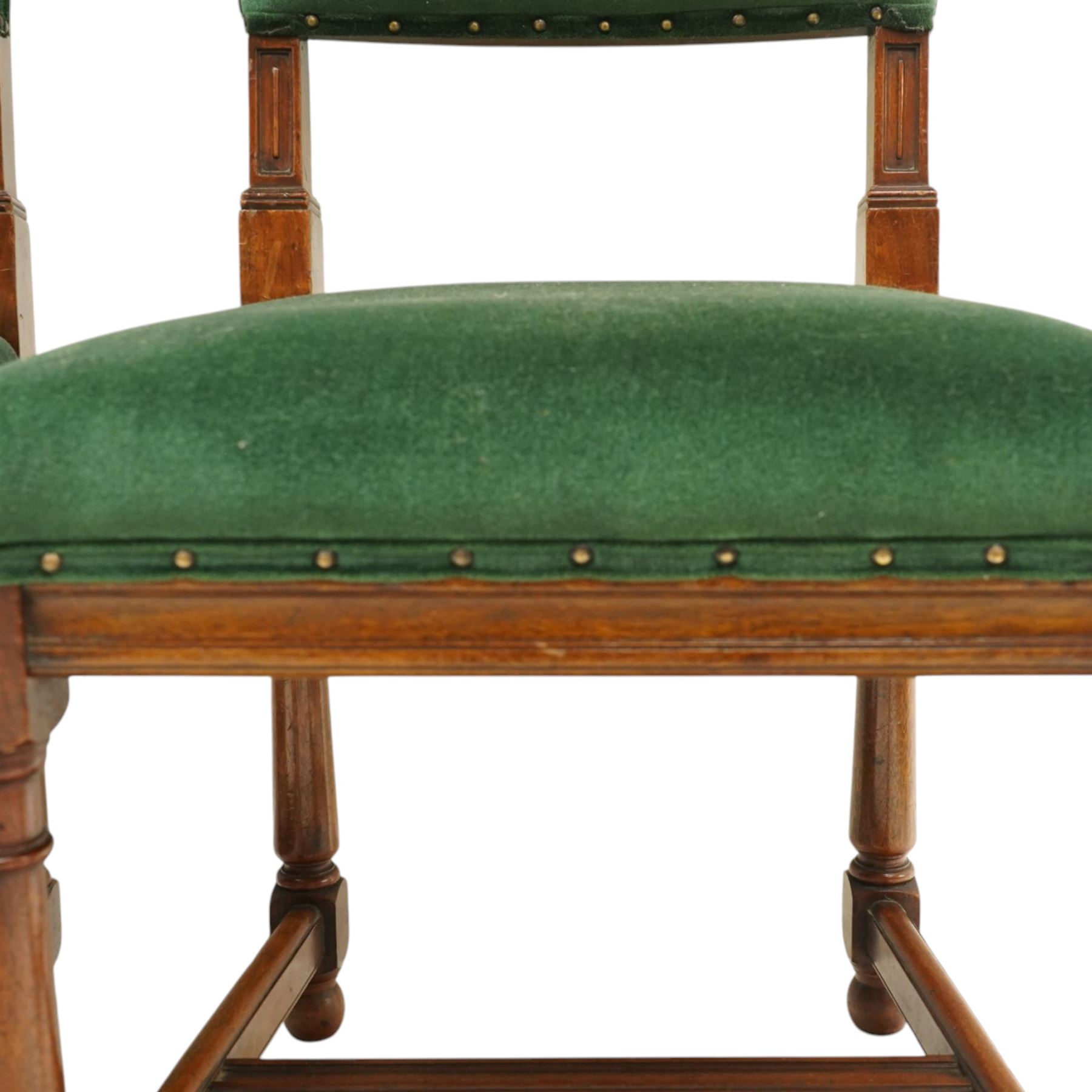 17th century style mahogany set of six dining chairs, with carved scrolled finials, padded green velvet upholstery, block and turned supports united by stretcher  