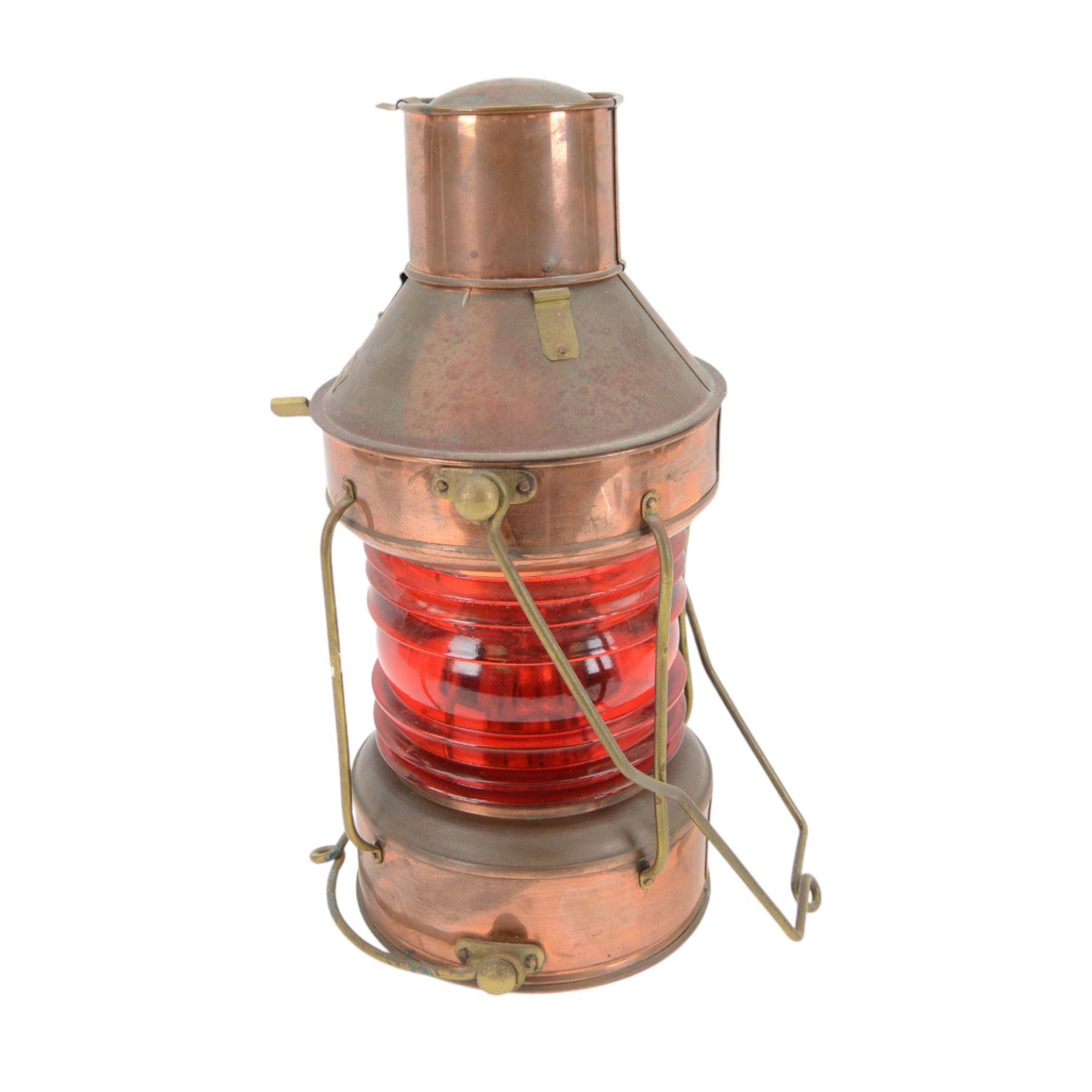Copper ships lantern with red glass, marked NUC with brass handles and fittings, H46cm