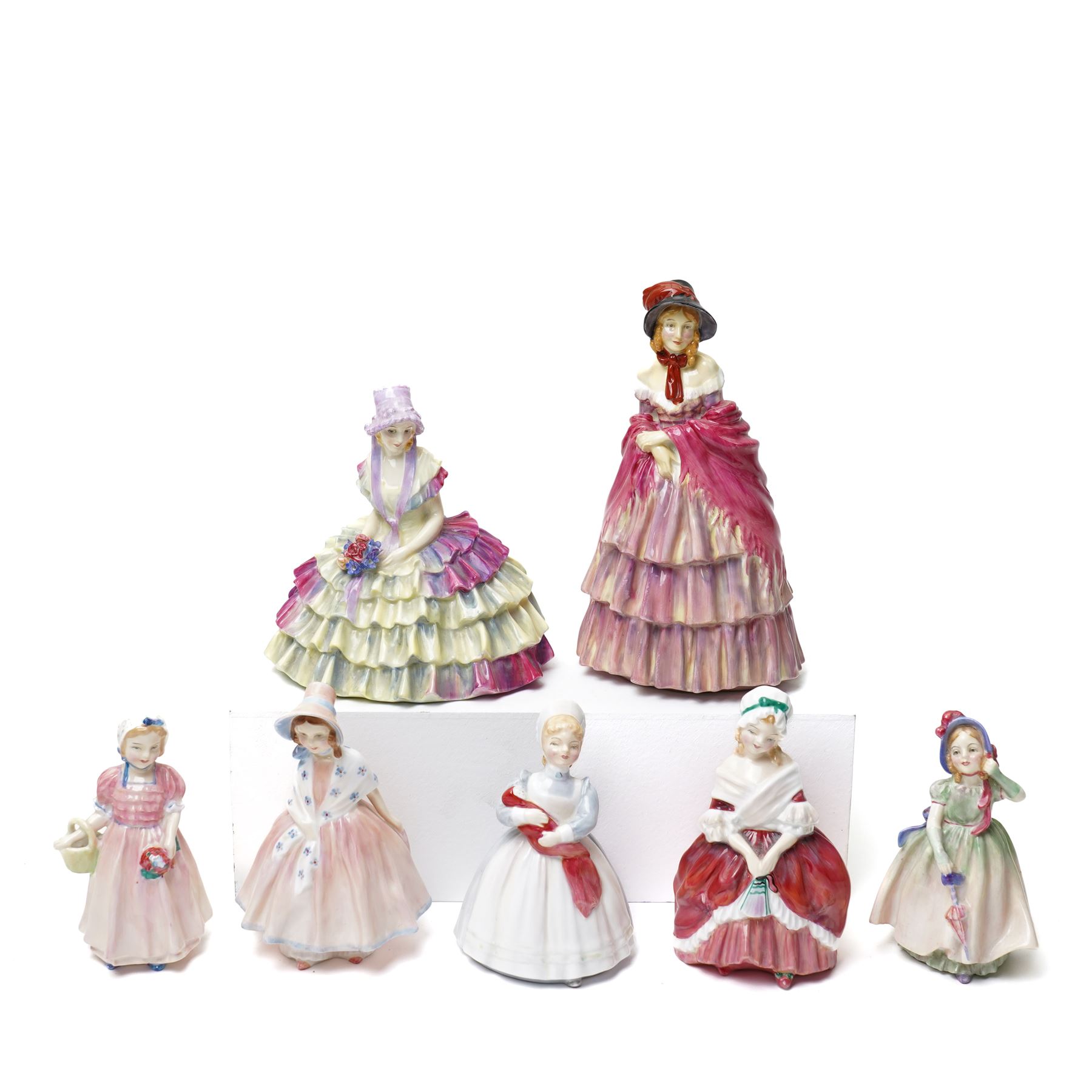 Seven Royal Doulton figures, comprising Chloe HN1470, A Victorian Lady HN727, Tinkle Bell HN1677, Babie HN1679, Lily HN1798, Peggy HN2038, The Rag Doll HN2142 (7)