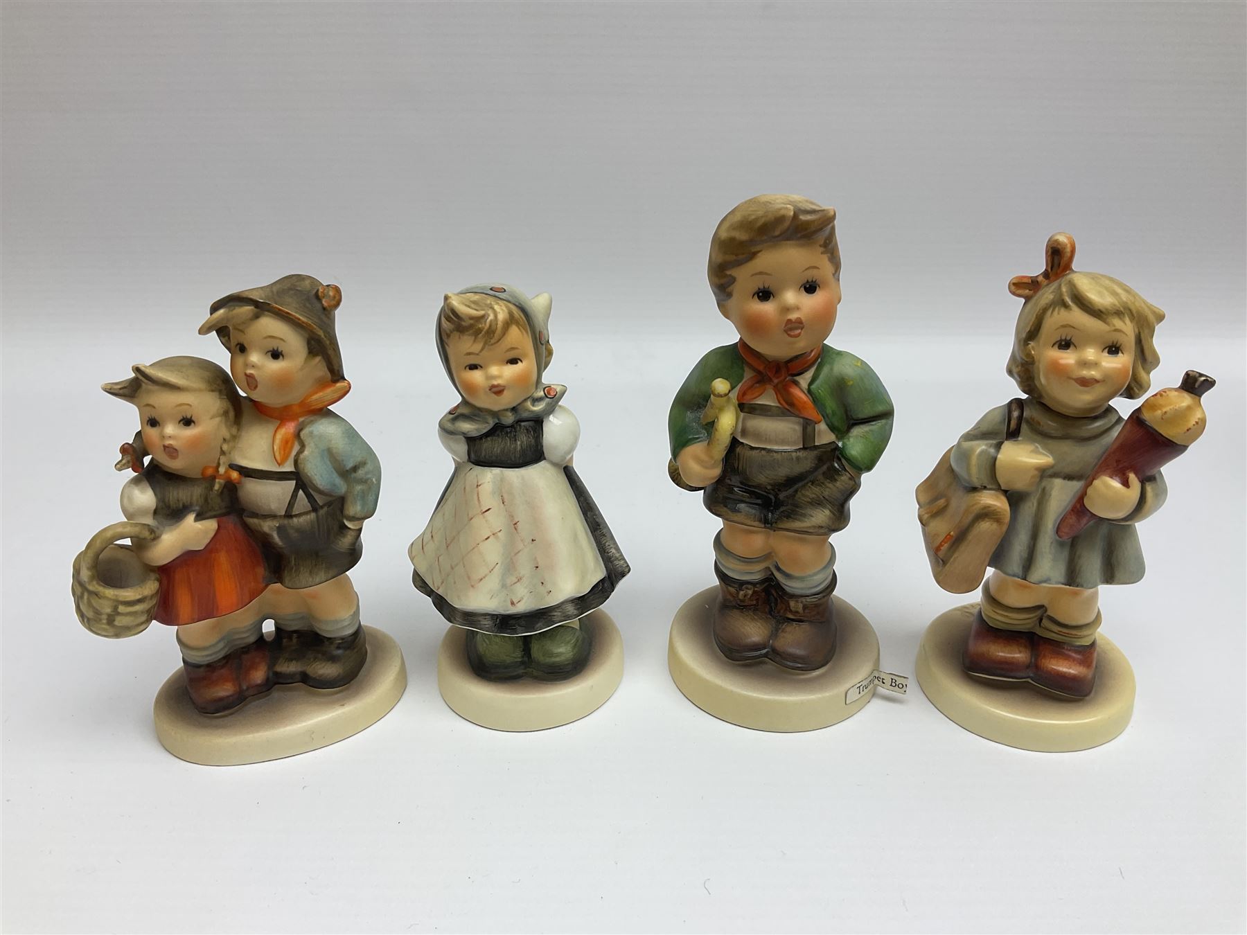 Twenty five Hummel figures by Goebel, to include Tuning up, Blessed Event, Book Worm, The Little Architect etc 