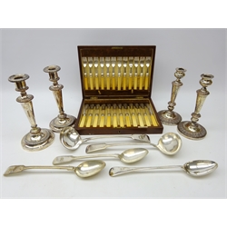  Two Victorian silver-plated ladles and three basting spoons, two pairs of Old Sheffield plated candlesticks (H26cm max) and Walker & Hall canteen of fish knives and forks, ivory handled with silver collars, Sheffield 1923 in oak case  