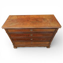 Late 19th century French provincial oak chest of drawers, moulded rectangular top with carved rope edge over four graduated long drawers with raised and fielded panels and ornate cast handles, canted angles and shaped apron below, standing on moulded block feet,