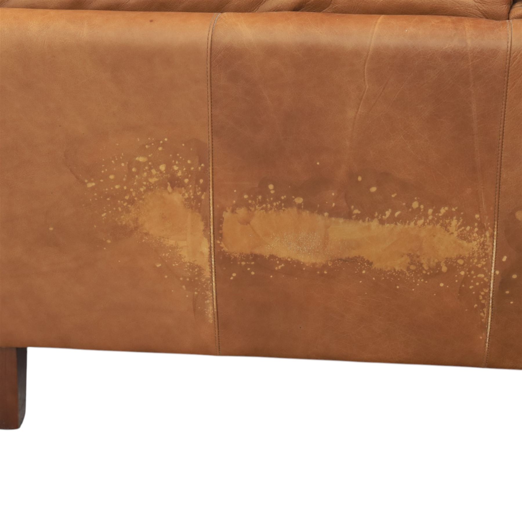 Two seat sofa upholstered in tan leather