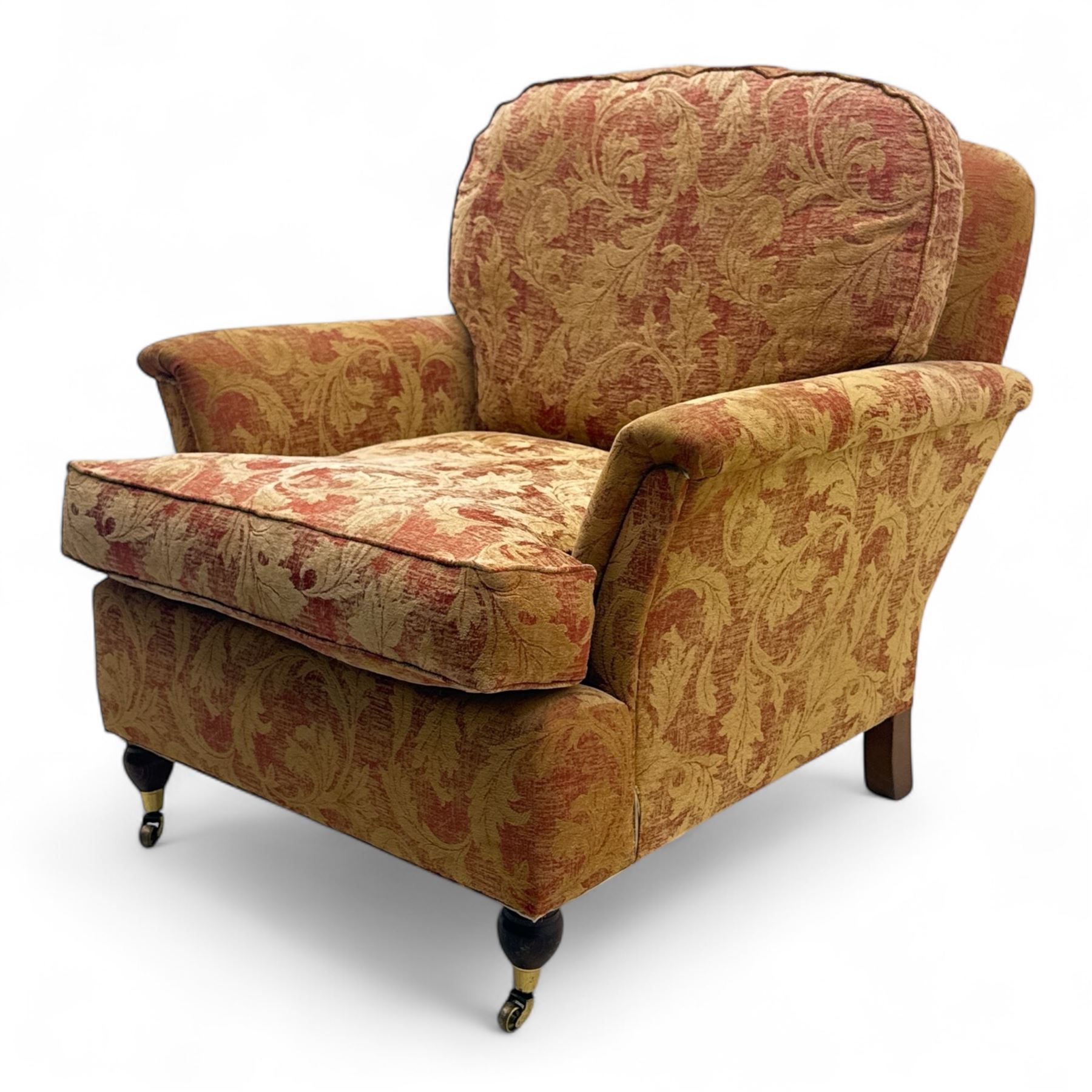 Duresta - Contemporary pair of upholstered armchairs, in red and gold damask style fabric, each with sprung seat and removable cushion back, rolled arms, on turned front supports with brass castors, square back legs 