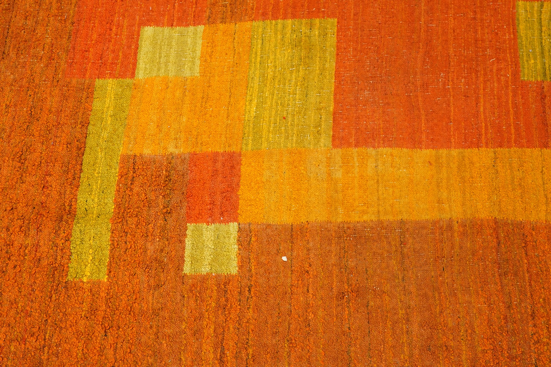 Vintage handwoven modernist rug with cubist design in contrasting tones of amber and orange