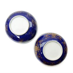 Pair of 19th century Samson of Paris bowl decorated in gilt with flowers and trailing leaves on a dark blue ground, the interior of one with a Japanese flower and the other with a floral spray D26cm 
Provenance: property of a Nobleman