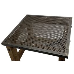 Reclaimed industrial wrought metal and pine table, metal mesh top on pine block supports united by stretchers 