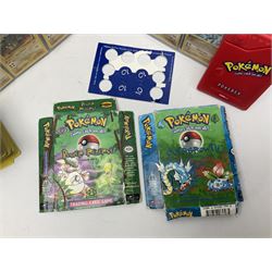 Collection of Pokemon trading cards, mostly 1999 Wizards Pokemon cards to include holo Charizard 4/102, first edition holo Machamp 8/102, further holographic cards; Dark Flareon 35/82 and Dark Vaporeon 45/82, cards from themed sets and 4th edition prints; 1998 Electronic Pokédex with cardboard boxes for themed decks Blackout, Overgrowth and Power Reserve Jungle, along with a large quantity of energy and trainer cards 