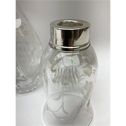 Clear glass decanter of slender oviform with silver collar stamped MN & WB 925, Mappin & Webb, together with an early 20th century silver photo frame hallmarked G & C Ltd of Birmingham, two clear glass shakers with pierced silver tops and silver collared glass storm lampshade with etched decoration, tallest H37.5cm