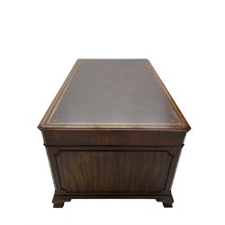 Large Georgian design mahogany twin pedestal partner's desk, moulded rectangular top with canted corners and inset leather writing surface, fitted with nine drawers and two cupboards, the pedestals with canted uprights decorated with blind fretwork, on ogee bracket feet