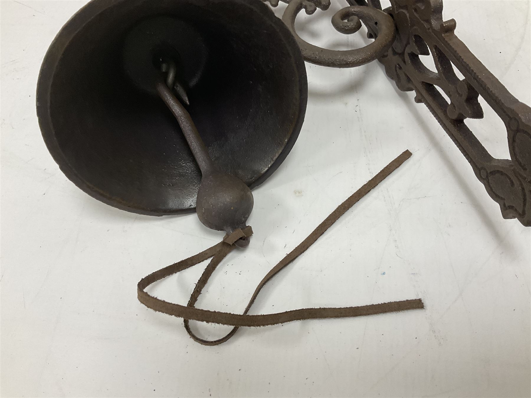 Cast iron exterior hanging garden bell with decorative butterfly bracket