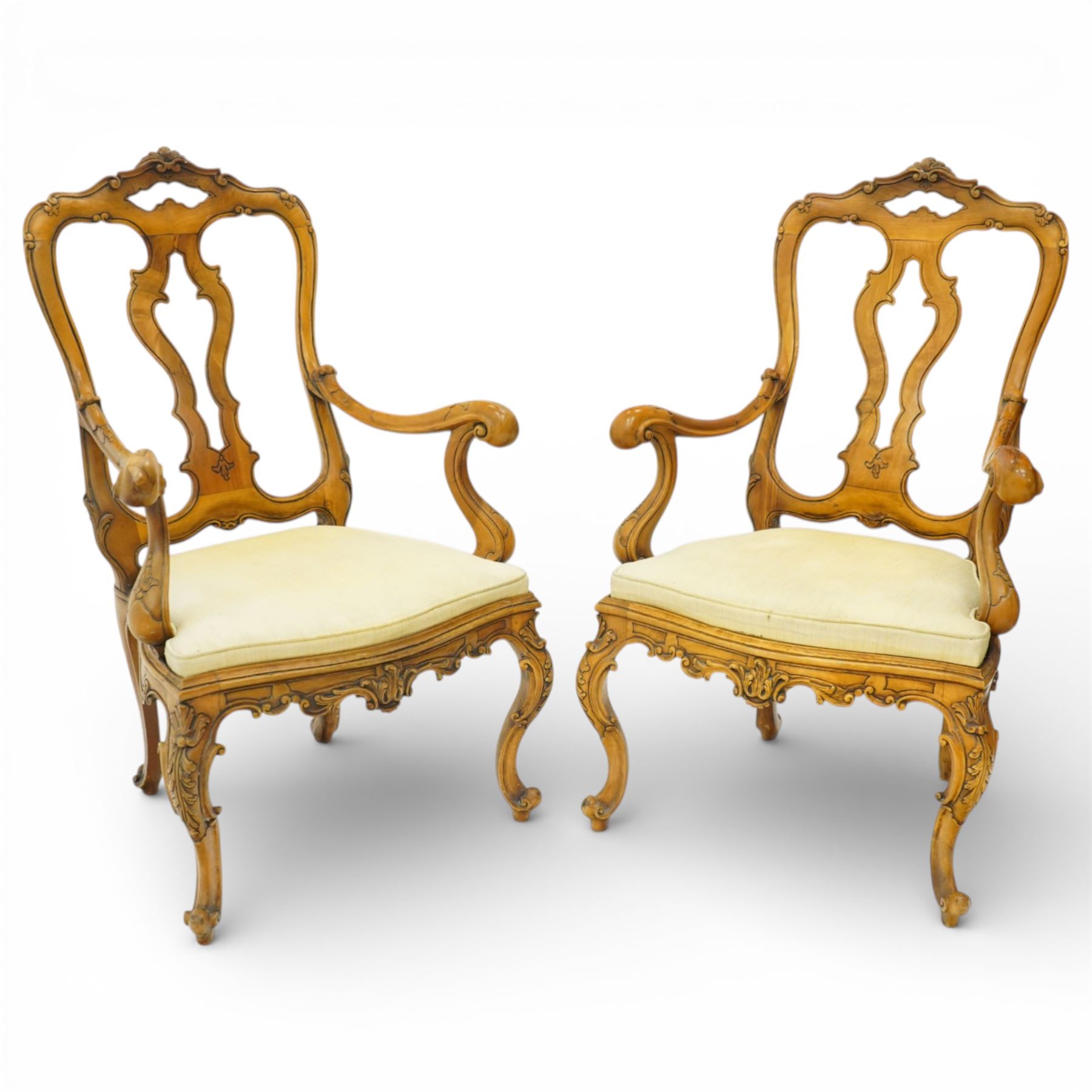 Pair of Italian carved walnut open armchairs, upholstered seats
