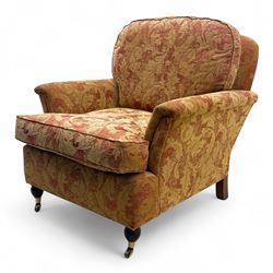 Duresta - Contemporary pair of upholstered armchairs, in red and gold damask style fabric, each with sprung seat and removable cushion back, rolled arms, on turned front supports with brass castors, square back legs 