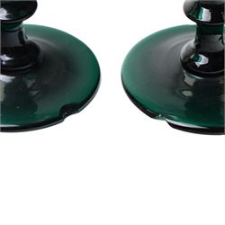 Five green wine glasses of early 19th century design with conical bowls and double knop stems on a circular foot, with pontil marks, pair of green wine glasses with chamfered stems together with an Asprey catalogue of green glass 1740-1840 and two pieces of glass fruit and leaves