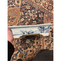 19th century Chinese blue and white planter and stand, each of square slightly tapering and flared form, the planter decorated with figures and precious objects between stylised foliate borders, the stand decorated with landscapes beneath a lipped rim with cell band, planter H28cm D25.5cm, stand H7cm D26cm