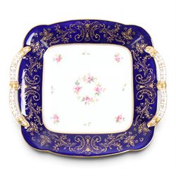 Coalport set of ten plates and four serving plates, each decorated with floral sprigs within a cobalt blue boarder with gilt detail, plates D22cm