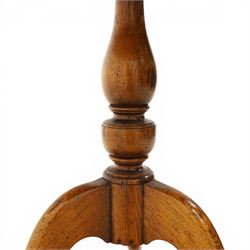 Traditional design golden oak tilt-top tripod table, brass fittings, turned baluster column on splayed supports