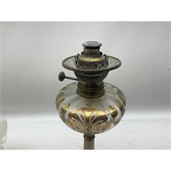 Brass mounted onyx column oil lamp, with a iridescent glass reservoir decorated with gilt floral decoration and etch glass shade, H64cm   