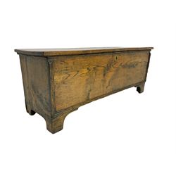 Oak six plank boarded blanket box, hinged lid enclosing candle box, the front with applied mouldings, on bracket feet 
