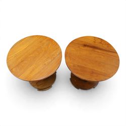 Pair of early 20th century oak lamp tables, circular tops raised on cluster-column pedestals, with circular platform bases and shaped bracket feet (2)