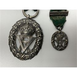 Victoria Volunteer Officers’ Decoration, V.R. cypher, hallmarked silver London 1892, with integral top riband bar and ribbon, unnamed; the matching miniature; and Victoria 'For Long Service in the Volunteer Force' miniature medal with ribbon in original case (3)