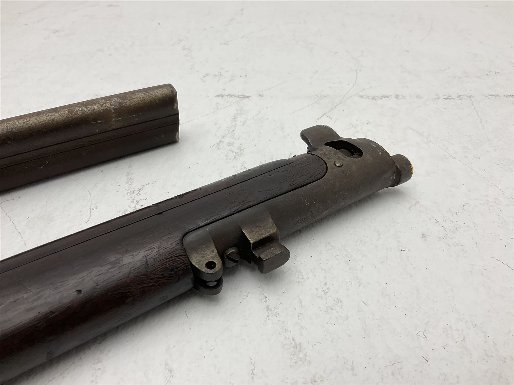 WW1 Lee Enfield SMLE .303 bolt action rifle with 63.5cm barrel and magazine; No.20934; L112cm overall; home deactivated by welding down bolt and end of barrel so requires re-deactivation to modern standards; and 19th century 12-bore double barrel hammer shotgun with 65cm cut-down barrels, non-rebounding hammers and under-lever opening, the lock-plate indistinctly inscribed G.T. Bartrant(?) L75cm overall; home deactivated by welding both barrels closed at breech so requires re-deactivation to modern standards (2) RFD ONLY 