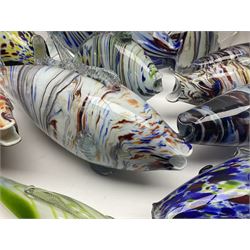 Collection of mid 20th century murano style glass fish, each with multi coloured inclusions largest L42cm