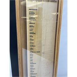 Two signed Yorkshire County cricket bats, bearing signatures including Anthony McGrath, Jacques Rudolph, Michael Vaughn and Matthew Hoggard, etc, both within glazed presentation boxes, box H86.5cm, together with a framed Darren Gough signed presentation print by Gary Keane