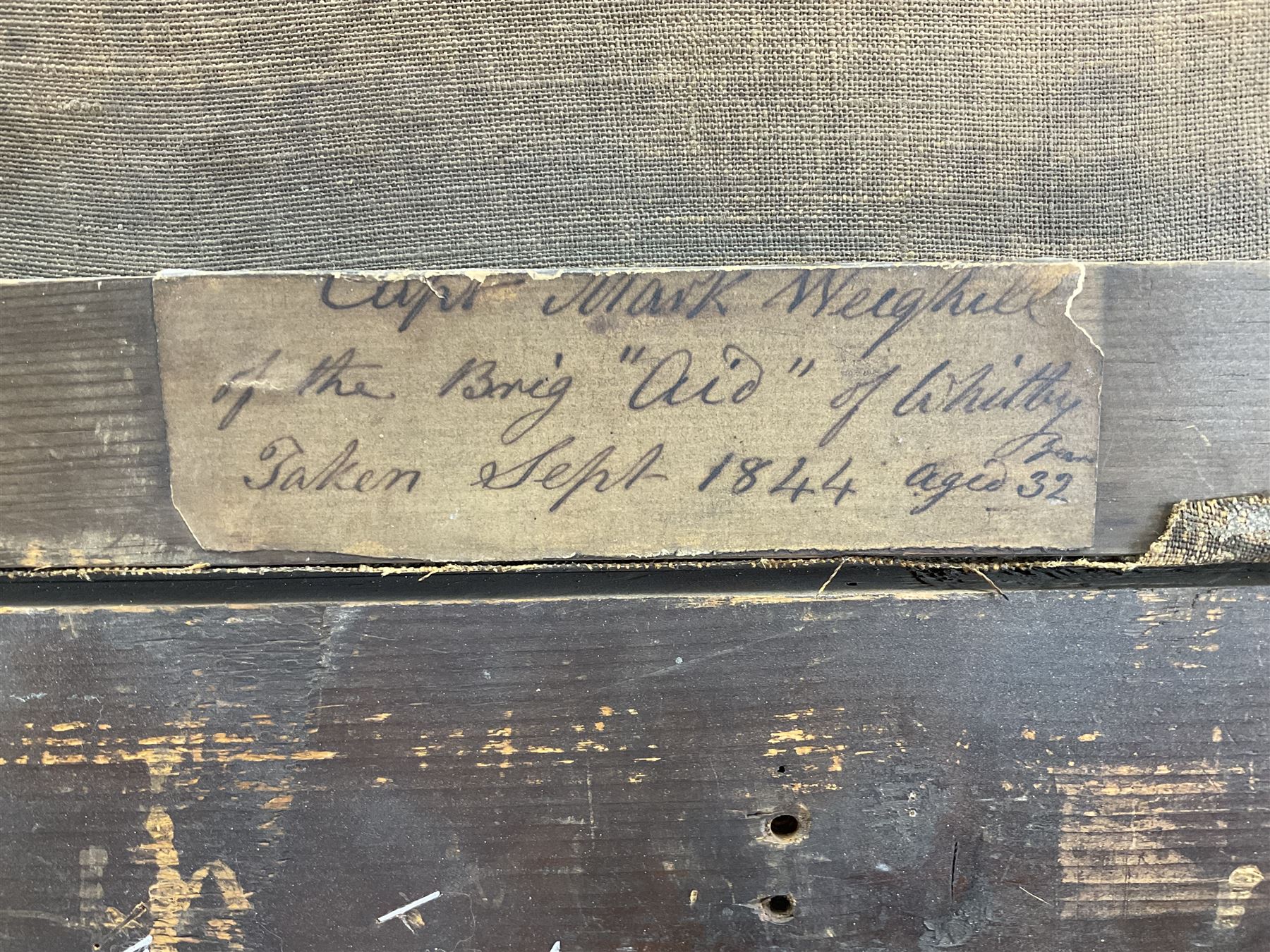 English School (Mid 19th century): 'Capt. Mark Weighill of the Brig Aid of Whitby' half length portrait holding a telescope, oil on canvas unsigned, original title label verso dated 'Sept. 1844 aged 32', 59cm x 46cm
Notes: the 181 ton Brig 'Aid' was built by Pickersgill & Miller of Sunderland but not until 1856. The vessel was initially owned by Gideon Smales of Whitby & later became owned by Isaac Seymour of Runswick near Whitby