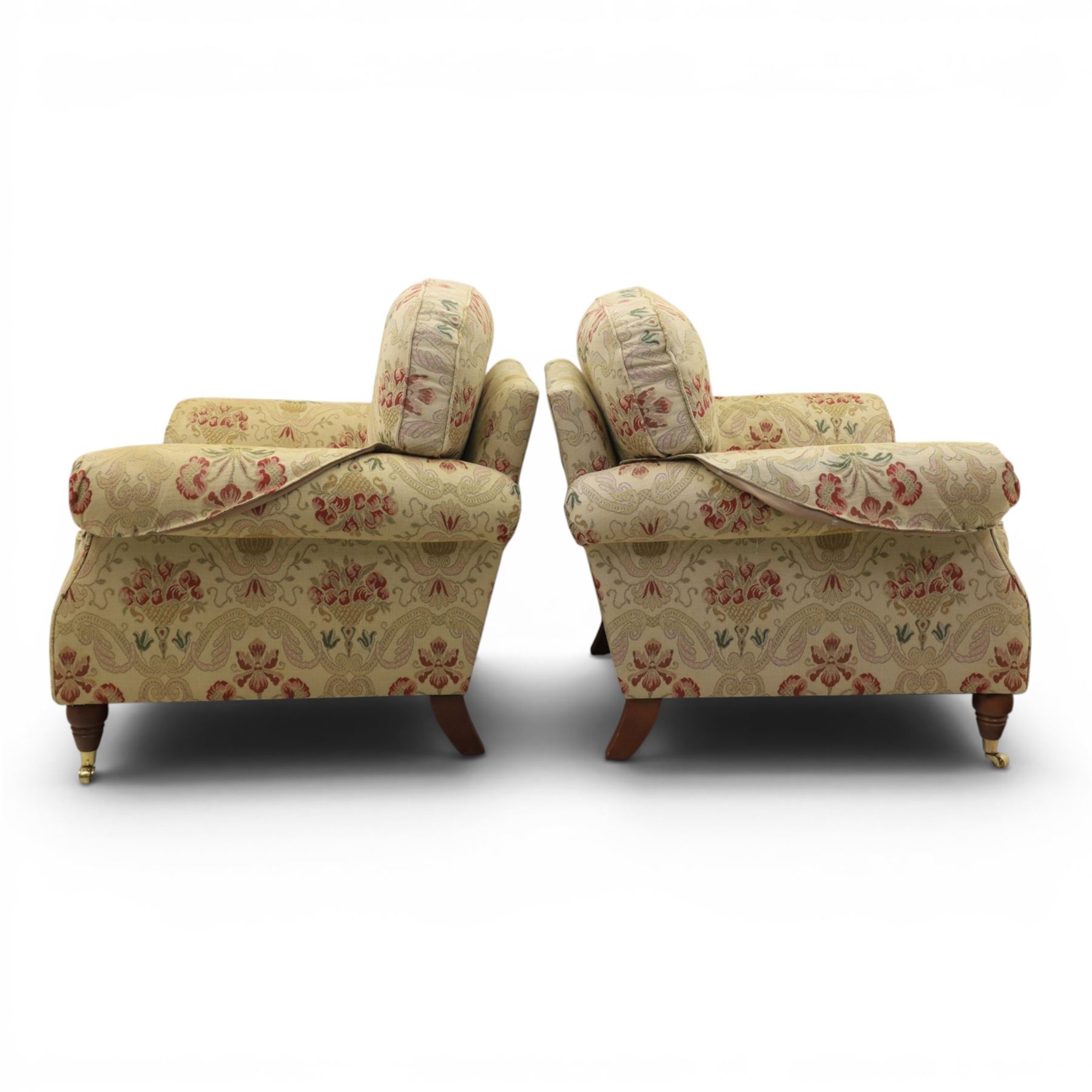 Parker Knoll - 'Henley' floral fabric living room suite, comprising a two seat sofa and pair of armchairs, raised on dark stained turned feet raised on brass castors

Armchairs (H 99cm, W 95cm, D 100cm)