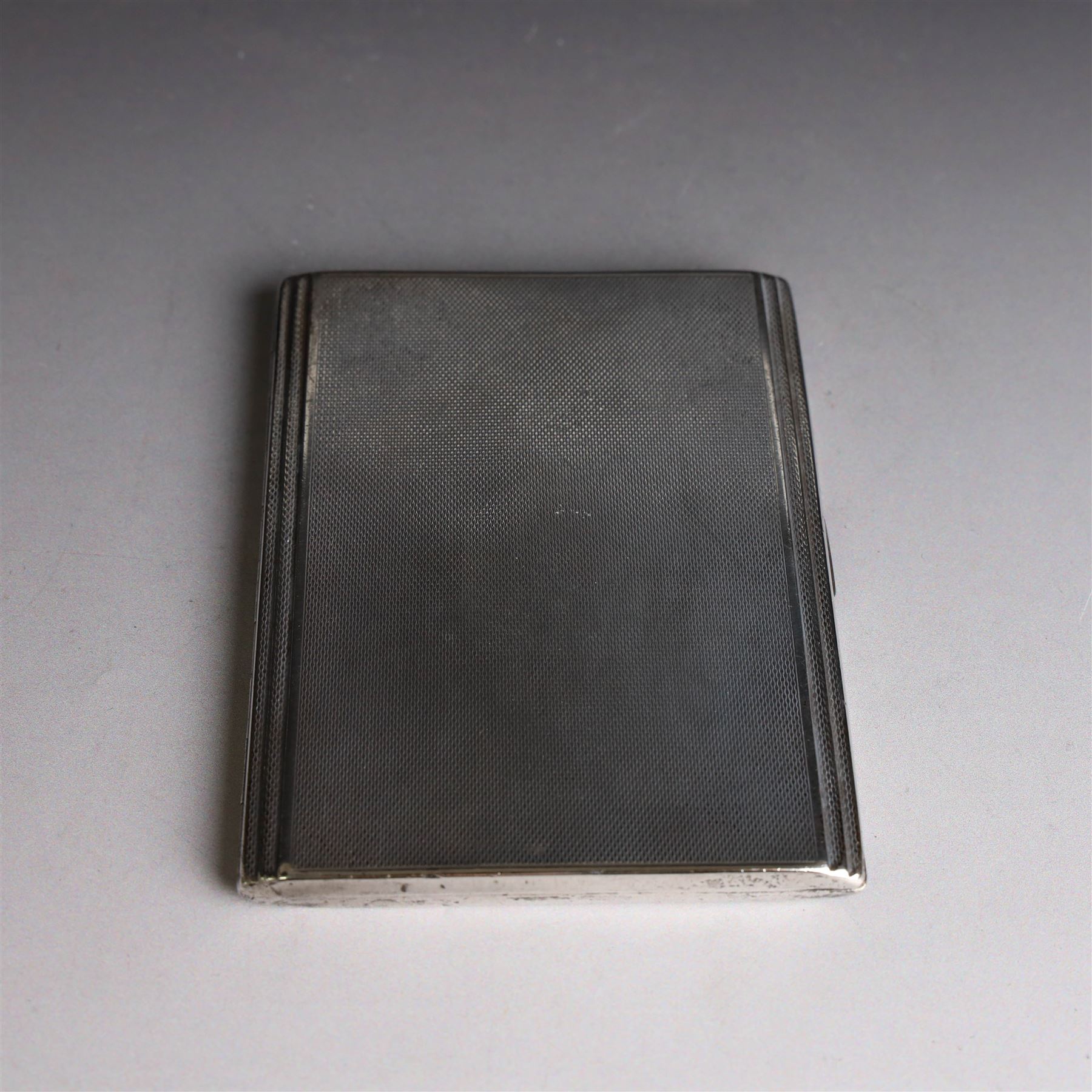 1930s silver cigarette case, with stepped design and engine turned decoration, hallmarked Clark & Sewell, Chester 1938, H11cm