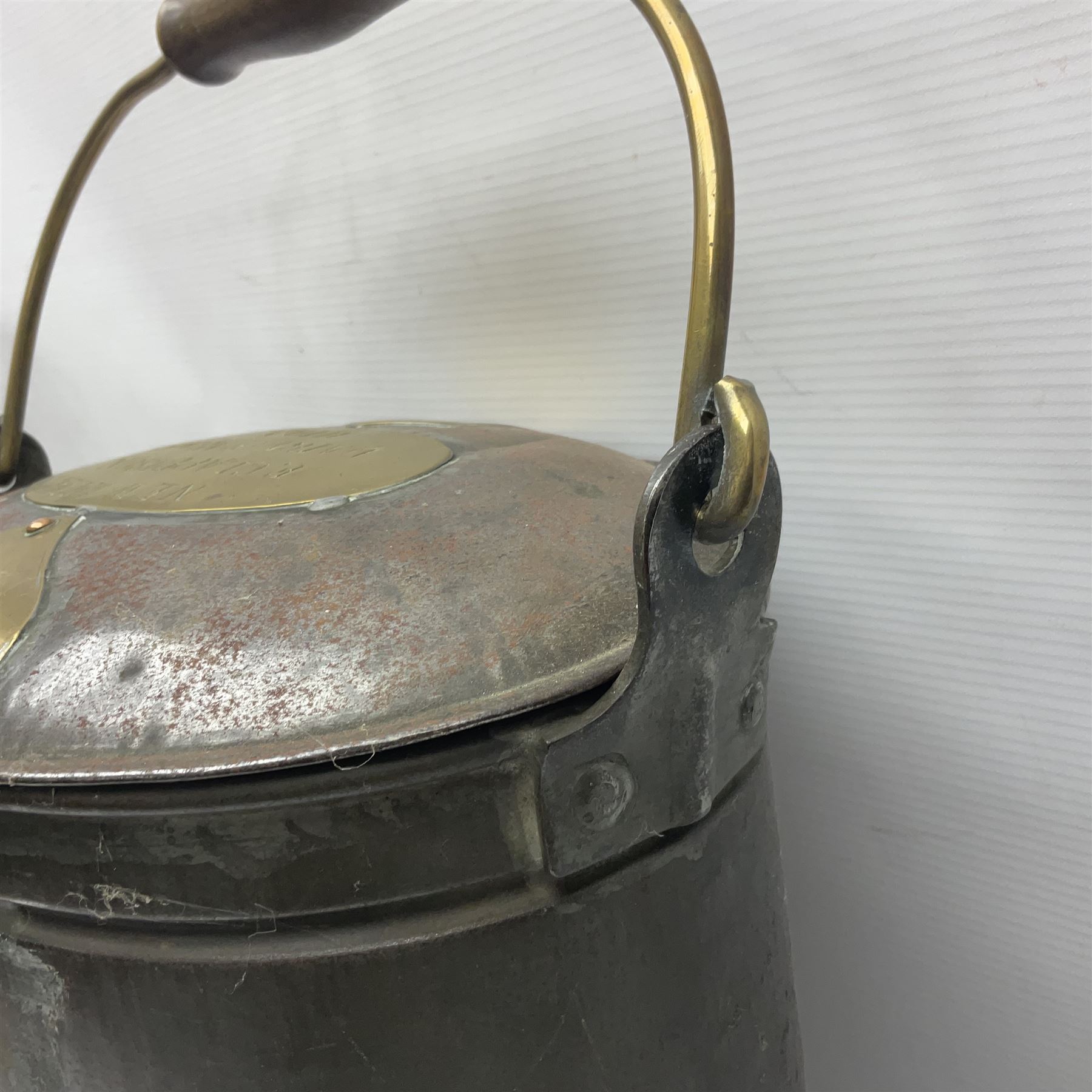 Late 19th/early 20th century steel and brass dairy pail or can, of oval form with swing handle, brass plaque to front and hinged cover inscribed 'F & T Ross Ltd Dairy Outfitters Hull', and 'New Milk F Clappison Dairy Farmer Hull', not including handle H30cm